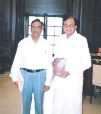 Finance Minister P. Chidambaram releasing a book, Indian Revenue Service: What Lies Beneath.