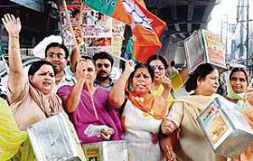 BJP workers protest near the clock tower against rising prices in Ludhiana