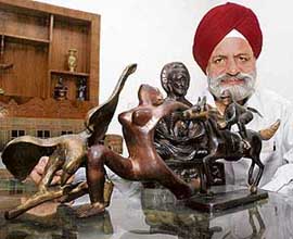 P.S. Sawhney with his collection of sculptures depicting different yoga asanas. 