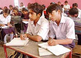 Sahil and Anup concentrate on studies in class VI at Government High School, Sector 24, Chandigarh