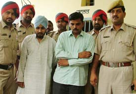 The fake DTO and his accomplice in police custody at Haibowal in Ludhiana on Friday