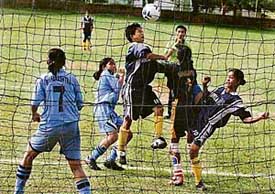 A match in progress between Maharashtra and Tripura during the Junior Girls Under-17 Football Championship at the PEC grounds in Chandigarh on Saturday.