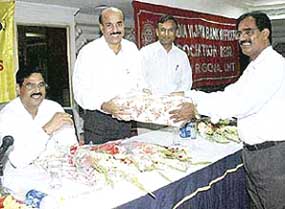  Mr A. Padmanabh Shetty, Officer- Director, Vijaya Bank (second from left) being honoured at a function in Sector 35, Chandigarh, on Sunday.