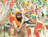 A kanwariya returning home after collecting Ganga Jal from Haridwar, in the Capital on Sunday. 