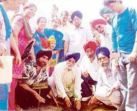 The Deputy Speaker of the Lok Sabha, Mr Charanjit Singh Atwal, along with the area councillor (Ward No. 39), Mr Jaswinder Singh Bhola, plant a sapling in Model Town park in Ludhiana on Sunday. 