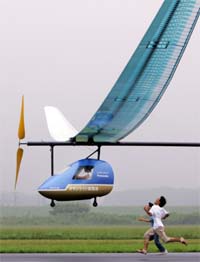 A manned aircraft powered by Panasonic's Oxyride dry cell batteries flies at Okegawa airport
