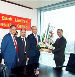 The Consul-General of India in Shanghai, Mr Vishnu Prakash (right), accepts a bouquet from the CMD of UTI Bank, Mr P.J. Nayak, at the inauguration