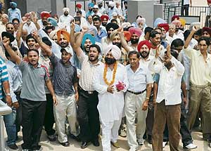 Mr Phoolraj Singh arrives with his supporters to file nomination papers for the MC elections from ward No. 11 in Mohali on Monday.