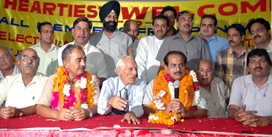 Mr Surjit Mehta along with Mr Y.P. Dogra addresses a news conference after his re-election as president of the Punjab Chemists Association in Ludhiana on Sunday