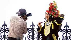 A tourist posing in the traditional hill gear on the Ridge in Shimla