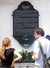 Foriegn tourists read the story of Shimlas origins.