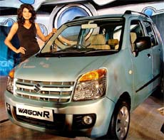A model poses with the newly launched WagonR Duo, which runs on LPG and petrol, in New Delhi on Wednesday. The Lx and Lxi variants, with ex-showroom prices in Delhi at Rs 3,40,106 and Rs 3,68,160, respectively, claim 10 per cent more fuel efficiency. Maruti is slated to roll out two new models later this year, including a new-look Zen and a diesel car.