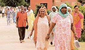 Residents of Sector-25, Colony, Chandigarh, coming to attend an awareness camp at Government School, Sector-25, Chandigarh