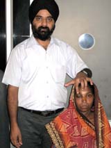 Dr Harminder Preet Singh along with patient Isher Wati