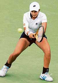 Sania Mirza returns a volley to Alexandra Stevenson of the US during the Western & Southern Financial Group Womens Open in Cincinnati on Tuesday.