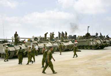 Israeli troops get ready before they enter south Lebanon at a military staging area in Rosh HaNiqra, near the northern border of Israel, on Wednesday. 