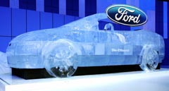 An ice sculptured car is unveiled as part of the launch of Ford's new environment-friendly cars that run on bio-ethanol fuel at the British International Motor Show in London
