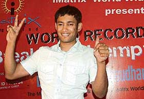 Biswaroop Roy Chowdhury, Memory Master of India, makes a victory sign after breaking the existing world record of Germanys Michaela Buchvaldova