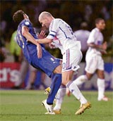 File picture shows Italys Marco Materazzi as he falls on the pitch after being head-butted by Frances Zinedine Zidane during their World Cup final match in Berlin 