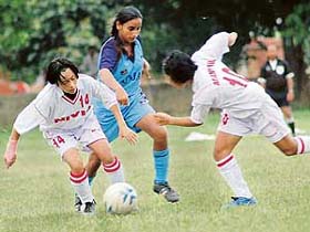 Manipur girls in action against Punjab in the third junior Girls (under-17) Football Championship in Chandigarh