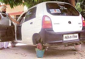 The car, whose tyres were removed by thieves in Phase IV, Mohali, on Thursday night
