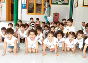 Students of Hollyhock Nursery School attempt yoga which has been introduced in the school in Ludhiana.