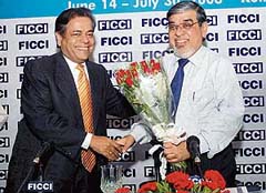 Mr T.S. Bhattacharya , Managing Director, State Bank of India, being greeted by Mr C.K. Dhanuka, Chairman, FICCI, at the Banking Conclave, 2006, in Kolkata