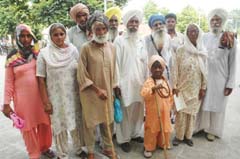 Pension-deprived residents of Sangowal village, Phillaur, during their visit to the District Administrative Complex, Jalandhar,