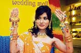 A model displays designer rakhis at a mall in Kolkata