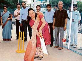 Shabnam Singh, mother of cricketer Yuvraj Singh, tries batting at the inauguration of a cricket academy at Panchkula on Tuesday