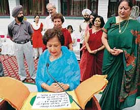 Mrs Jean Rodrigues, First Lady of Punjab and Chandigarh, inaugurates the Red Ribbon Club for AIDS Awareness, while Ashwani Kumar, DPI (Schools), and Ms Madhu Bahl, Principal, and staff look on at KBDAV School, Sector 7, Chandigarh, on Tuesday
