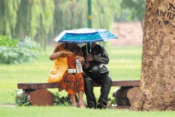 An old couple enjoying the showers at Boat Club on Tuesday afternoon.
