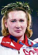 Womens Olympics discus throw gold medal winner Natalia Sadova of Russia poses on the podium during the 2004 Athens Olympic Games. Sadova has been banned for two years after failing a drugs test, athletics world governing body IAAF said on Tuesday