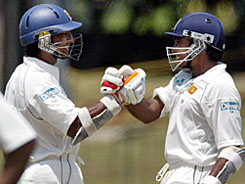Sri Lankas captain Mahela Jayawardene (right) and Kumar Sangakkara congratulate each other after they compiled an unbeaten world-record partnership of 578 on the third day of their first Test against South Africa in Colombo on Saturday.