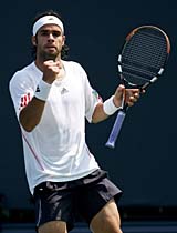 Fernando Gonzalez of Chile celebrates after beating Andre Agassi during the quarterfinals of the Countrywide Classic in Los Angeles on Friday. Gonzalez won 6-4, 3-6, 7-5. 
