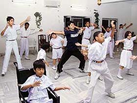 Instructors from Shiamak Davars institute conduct a workshop, arranged by the Durga Das Foundation, for special children of the Asha School being run by the Army at Chandi Mandir