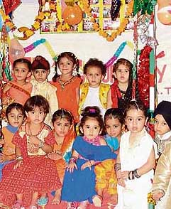Students of Dil Nursery School enjoy swings to celebrate Teej at a function held in the school on Monday.
