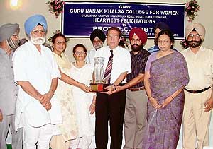Panjab University Vice- Chancellor, Prof R.C. Sobti, being honoured at a function held at the Guru Nanak Khalsa College for Women, Gujarkhan Campus, Model Town, Ludhiana, on Sunday. Photo: Inderjit Verma