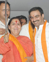 Uma Bharti, president of the Bharatiya Jan Shakti, raises the sword during “Swabhiman rally” in Jalandhar