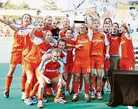 Members of the Netherlands hockey team celebrate after winning the Champions Trophy in Terrassa, near Barcelona, on Sunday. Netherlands beat Germany 2-1 in the final.