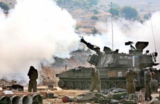 An Israeli artillery unit fires a shell towards Lebanon from its position near the northern border on Monday. 