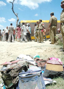 Bags lie in the open after being retrieved from a school bus that plunged into a canal near Sonepat on Tuesday