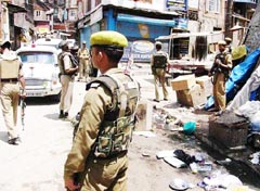Security forces search the area where militants fired from point black range killing two CRPF jawans near Dal Lake in Srinagar 