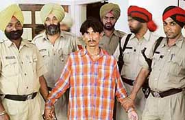 Ramesh, an accused in a murder case, in the custody of the Ludhiana police.