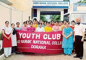 Members of the Youth Club of Guru Nanak National College, Doraha, with the Principal, Dr Narinder Singh Sidhu, and the in charge of the wing for girls, Mrs Harwinder Kaur, at the start of the public information rally at Sahnewal on Monday.