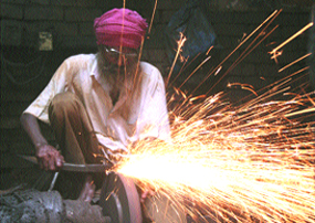 A craftsman gives final touches to a sword in Amritsar. 