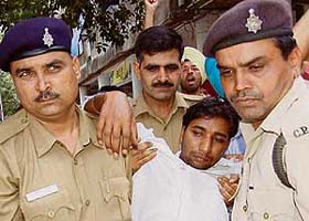 The Chandigarh police takes away protesting unemployed physical training instructor (PTI) Sukhjinder Singh Jainpur outside the DPI (Punjab) office, Sector 17, Chandigarh