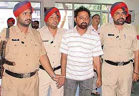 Inderjit Singh of Mukerian who has been caught for looting at least 28 persons and murdering a head constable