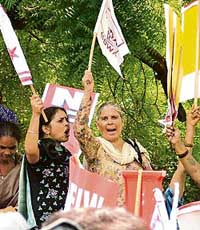 Women activists under the banner of the All-India Democratic Women's Association and the National Federation of Indian Women demonstrate for 33 per cent reservation for women in Parliament at Parliament Street in New Delhi on Wednesday. 