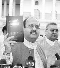 SP leader Amar Singh shows Vedantas BILLIONS which, he alleged, contained references linking P. Chidambaram, Union Minister for Finance, with Anil Aggarwal, who has a majority stake in Sterlite Group, which has bought BALCO, during a press conference after the chair adjourned the Rajya Sabha, at Parliament House in New Delhi on Wednesday. 